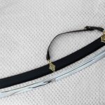SiCh-KzO saber beside its black scabbard, viewed from the blade tip