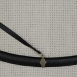 SiCh-Sh saber in a black scabbard with decorated fittings and a suspension strap, side view