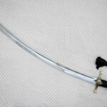 SiCh-Hetman saber blade in diagonal view, showing the curved profile, tip and long fuller