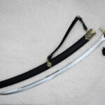 SiCh-Hetman saber and black scabbard arranged diagonally, with decorated guard, carrying strap and tassel