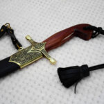 SiCh-Souvenir saber: reddish-brown grip, decorated guard and black scabbard