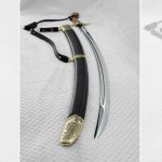 SiCh-K saber and black scabbard side by side, with the hilt at the top