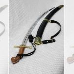 SiCh-K saber and black scabbard viewed from the brown grip and decorated guard