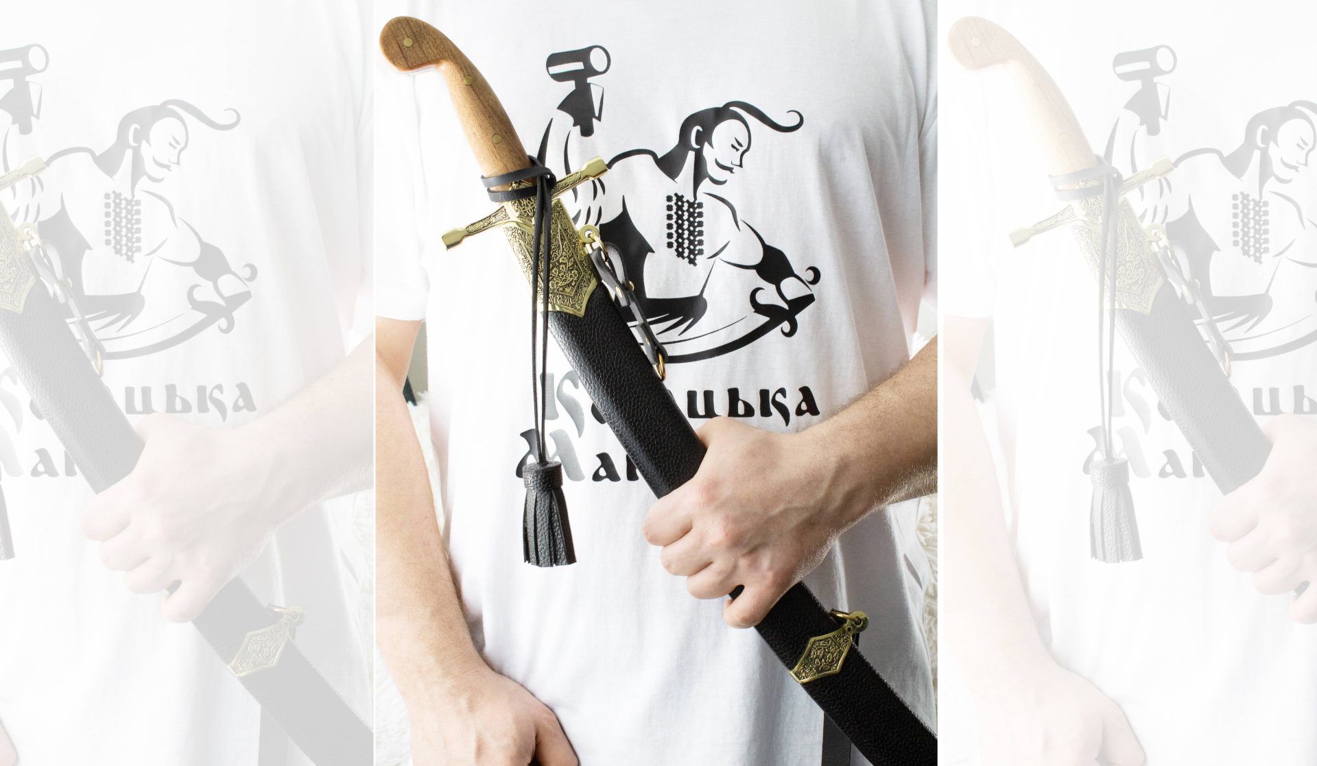 SiCh-K saber held in its black scabbard, showing the brown grip and hanging tassel